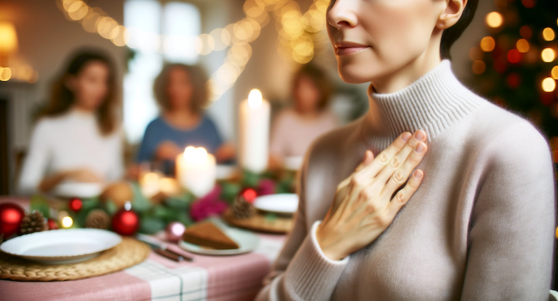 A horizontal image showing a woman at a festive holiday dinner table, stepping away to a quiet corner to practice EFT tapping.