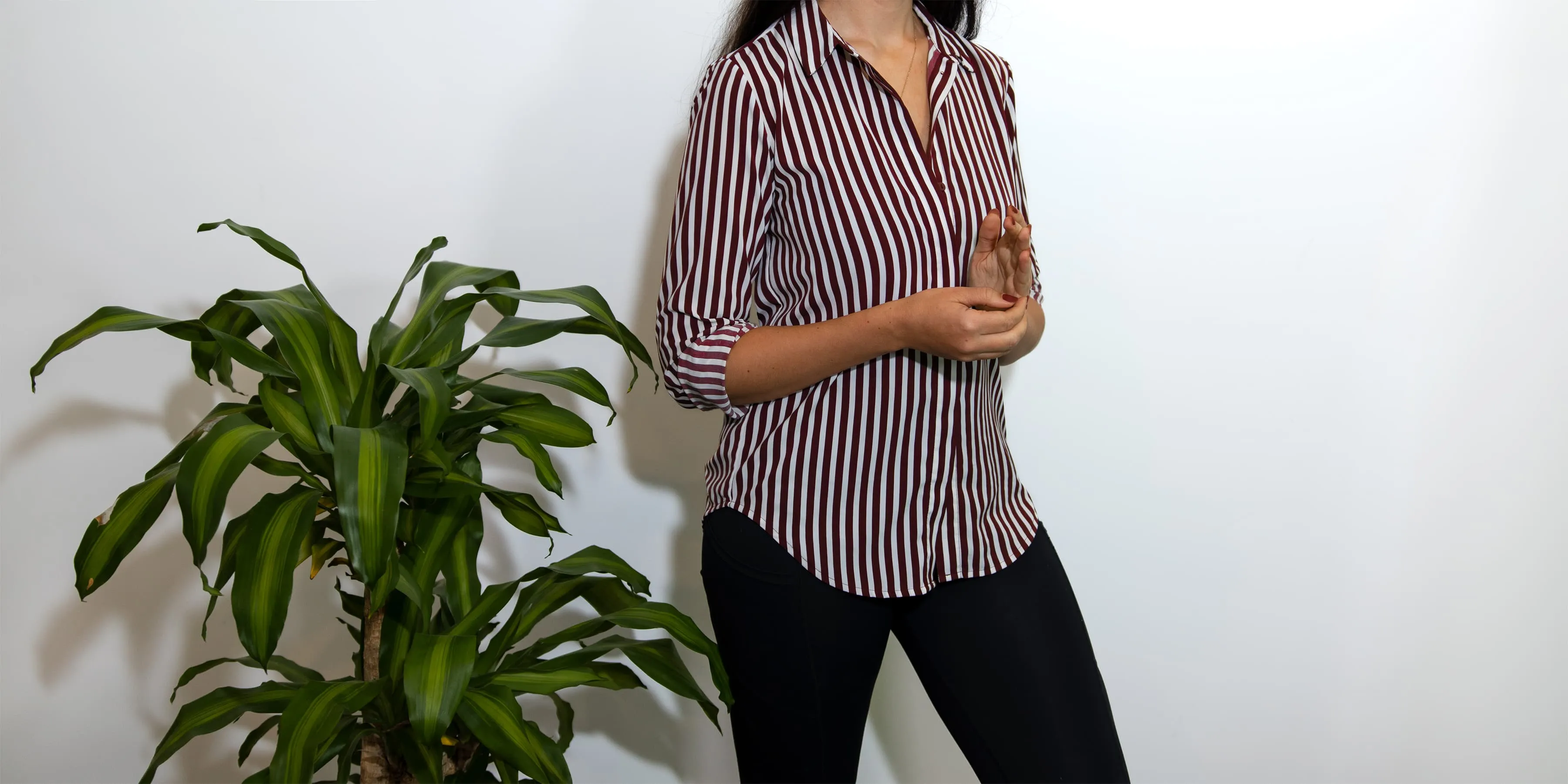 Zoe West, life and relationship coach, demonstrating EFT tapping by tapping on the side of hand point.